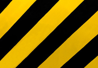 Traffic Sign: A rectangular sign with diagonal yellow and black stripes, wherever there is a median or other obstruction. Drive in the direction of the slope of the stripes to avoid the obstructions.