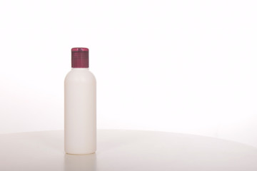 Cosmetics in bottles of plastic containers and tubes