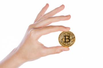 Fototapeta na wymiar Young girl hand holding bitcoin on white