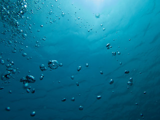 Bubbles in clear blue water