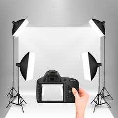 photo studio with photo camera in hand vector