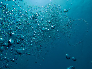 Bubbles in clear blue water