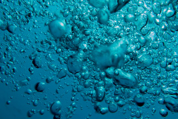 Bubbles in clear blue water