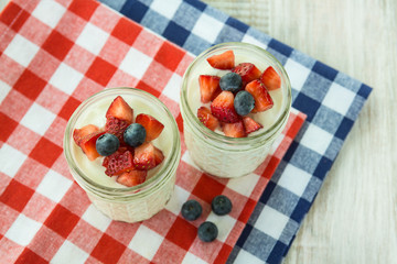 Two Fresh Yogurt With Strawberries and Blueberries From Above