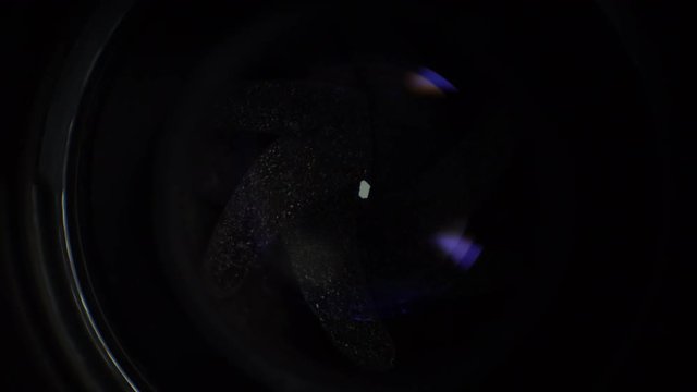 Beautiful inside. A beam of light periodically illuminates the closed aperture of the camera - the view from behind