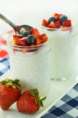 Breakfast Yogurt With Strawberries and Blueberries with Spoon