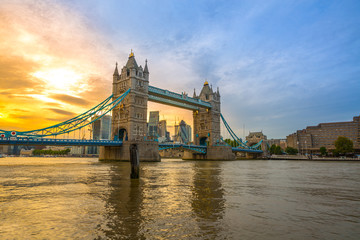 Famous Tower Bridge in the evening with sunset sky and reflex on water, London, England
