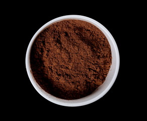 pile cocoa powder in bowl isolated on white background