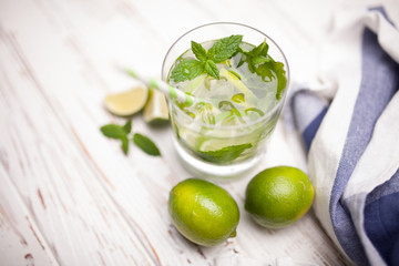 Mojito cocktail on white wood background