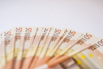 50 euro banknotes in a row. European Union Currency. Stack of 50 euro banknotes.