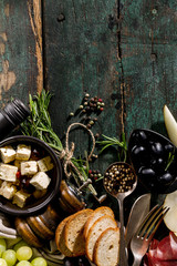 Tasty Italian Greek Mediterranean Food Ingredients Top View on Green Old Rustic Table Above