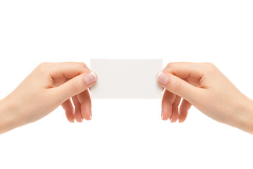 Female hands hold white card on a white background.