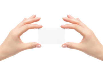 Female hands hold white card on a white background.