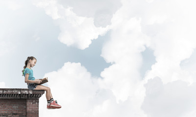 Concept of careless happy childhood with girl exploring this wor