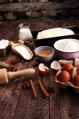 Fototapeta na wymiar Bakery ingredients - flour, eggs, butter, sugar, yolk, almond nu