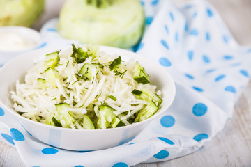 Salad with kohlrabi, cucumber and dill.