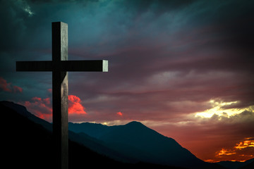 scene with Jesus cross on a background with dramatic sky and colorful sunset, sunrise. Jesus Christ...