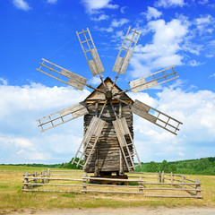 Fototapeta premium Old wooden windmill against the sky.