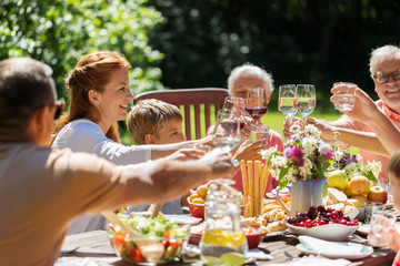 happy family having dinner or summer garden party