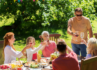 happy family having dinner or summer garden party