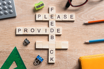 Conceptual media keywords on table with elements of game making crossword