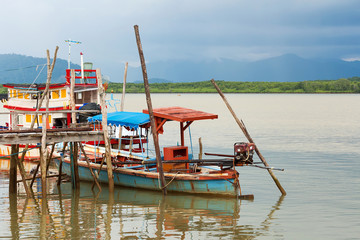 Fototapeta na wymiar Thai long tail boats in the harbour, Thailand