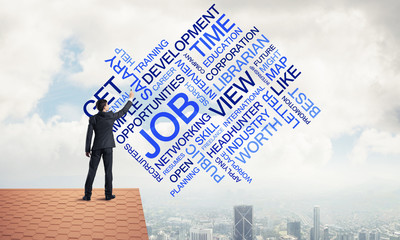 Young businessman standing on house roof and writing leadership 