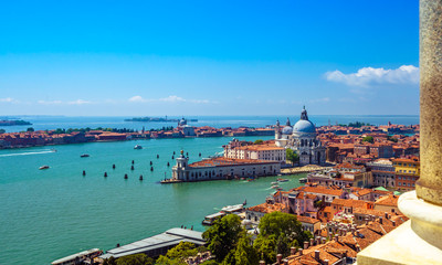 Fototapeta na wymiar Aerial panorama of Venice at sunny day ,Italy with stone pillar on the foreground