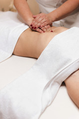 Doctor pressing woman gizzard