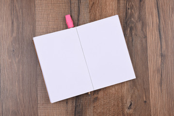 Open writing pad with a pencil