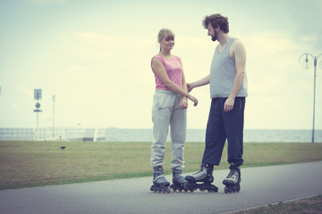 roller skater couple skating outdoor