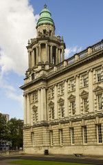 Obraz premium The North East corner tower of the impressive Belfast City Hall in Belfast Northern Ireland is a fine example of Baroque Revival Architecture