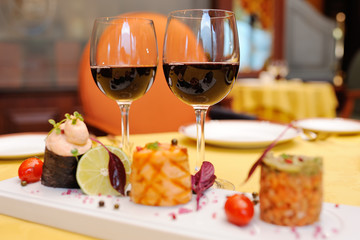 two glasses of red wine on the background of the delights in the restaurant