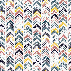 Abstract geometric seamless hand drawn pattern with tribal motifs. Modern texture. Colorful free hand background.