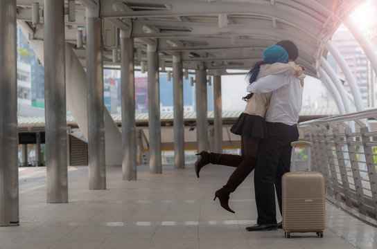 Woman Jump And Hug Her Husband In The Airport