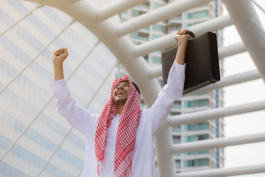 Arab or Muslim business man celebrating after project complete feeling so happiness