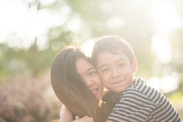 Fototapeta premium Single mom walking with son together with happy face