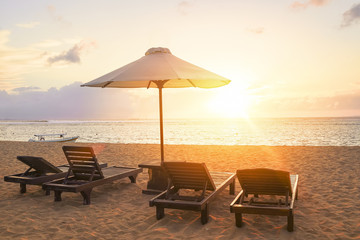 Stunning beautiful sunlight beach with relaxing scenery on a beach. Famous travel destination in Sanur, Bali, Indonesia.