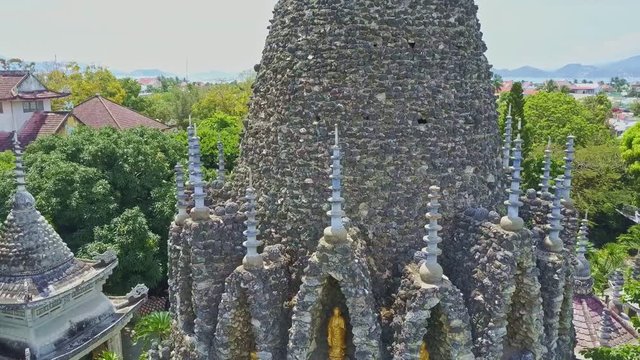 Drone Rotates around Buddhist Temple Tower Steeples