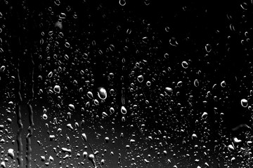 Raindrops on black glass - 169064185
