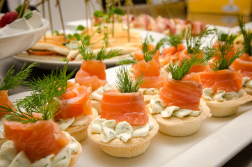 Tartlets with cheese filling and salted salmon