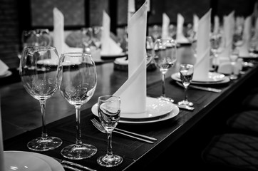 Empty glasses in restaurant. Table setting for dinner