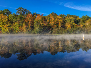 Fog on Mirror Lake separating the horizon from the reflection