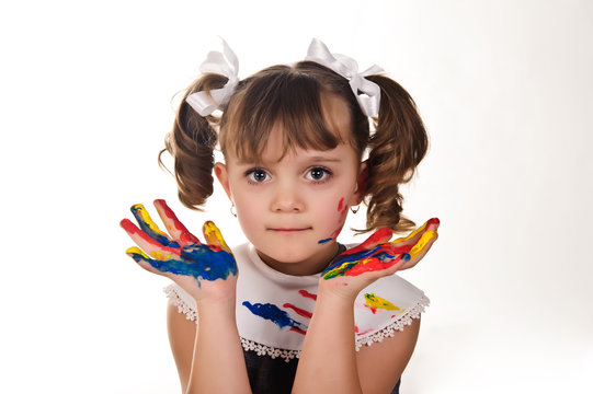 Little girl with hands soiled