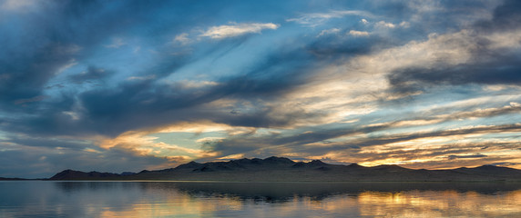 panoramic view of seascape with mountain hills at cloudy day
