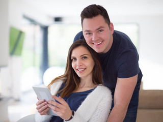 couple using tablet at home