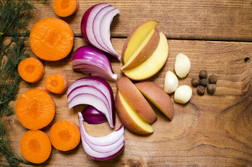 Vegetables on the wooden brown table. Vegetarian food. Raw grocery preparation for cooking.