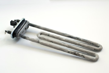 Washing machine heater with scum on a white background