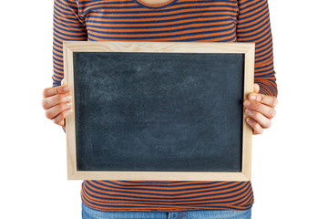 Female hands holding small black chalkboard in front of the body closeup isolated on white background with copy space
