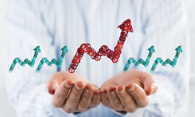 Progressing graph presented in male palms as symbol of success and improvement